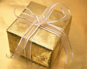 Christmas Present Wrapped in Gold and Silver